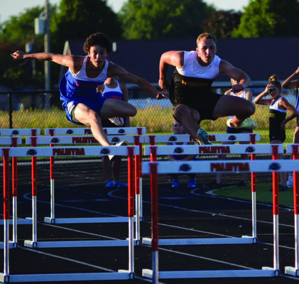 Robert Goehl from Missouri and Reid Savage from Illinois competing in the 110 meter hurdles.
