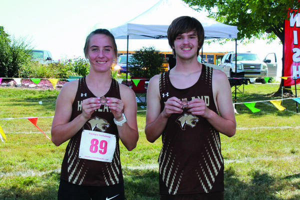 Kaycie Stahl and Ethan Clow with their medals from Palmyra