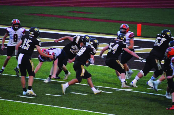 Robert Goehl #18 going for the score after receiving the ball from Drew Mallett #15. Also pictured is Aidan Lay #56, Will Harmon #54, and Blake Kaylor #63.