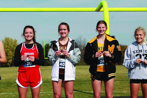 All-District medal and standing in between Clark County’s Cady St. Clair and Monroe City’s Meghan Hays with Mark Twain’s Matera Ellis to the far right.
