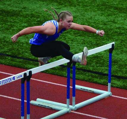 Shannon O’Neil competing in the 100-meter hurdles.