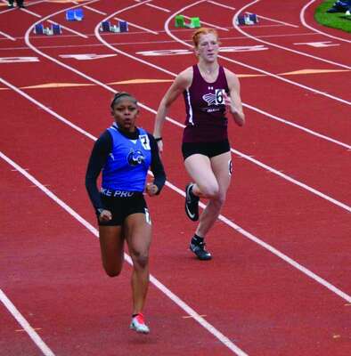 Emma Smith running in the 100-meter dash.